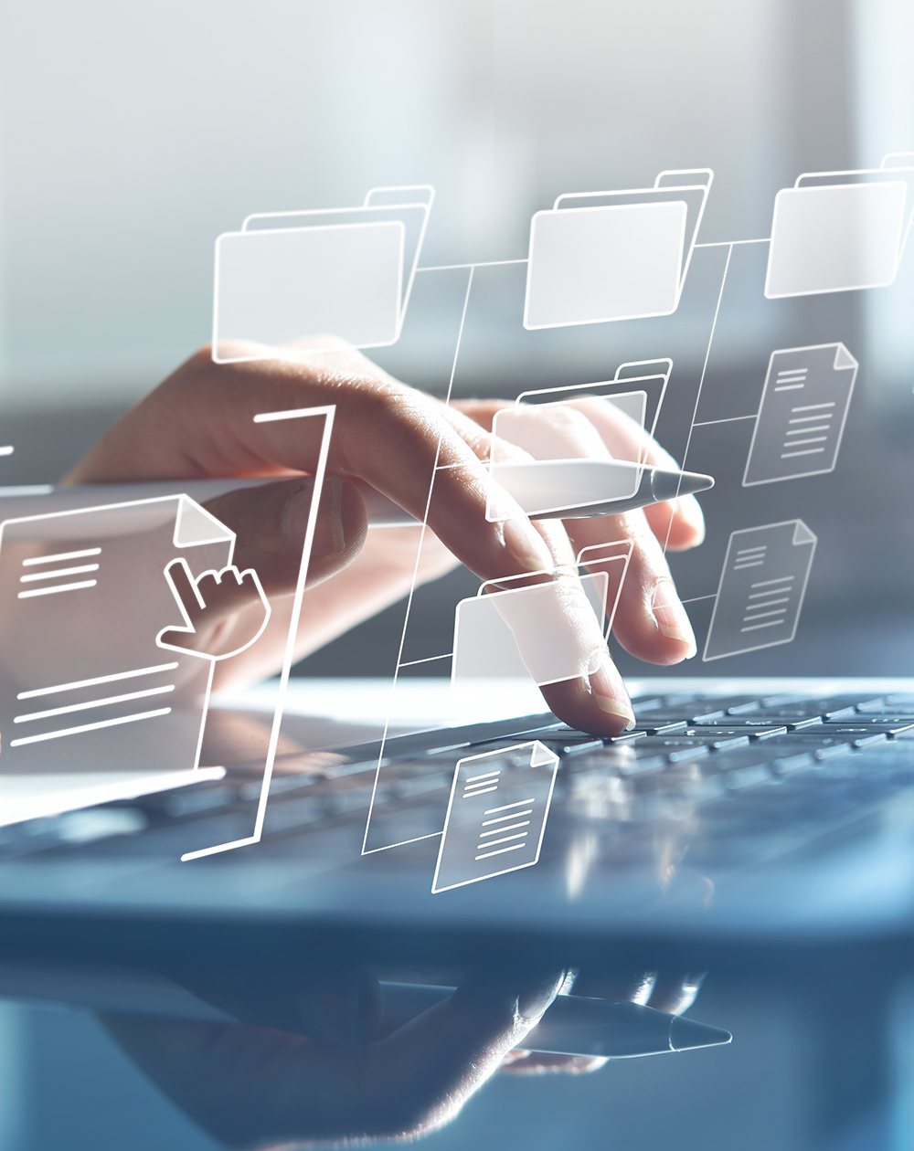 Document Management System (DMS) being setup by IT consultant working on laptop computer in office with document directory. Software for archiving, searching and managing corporate file information